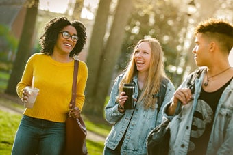 A group enjoys a laugh at Regent University, ranked #1 for Best Online Bachelor’s Programs in Virginia for 8 consecutive years by U.S. News & World Report, 2020.