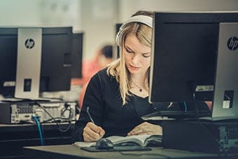 A girl studies at Regent, ranked among the Top 5% Most Affordable Private Christian Universities, 2018.