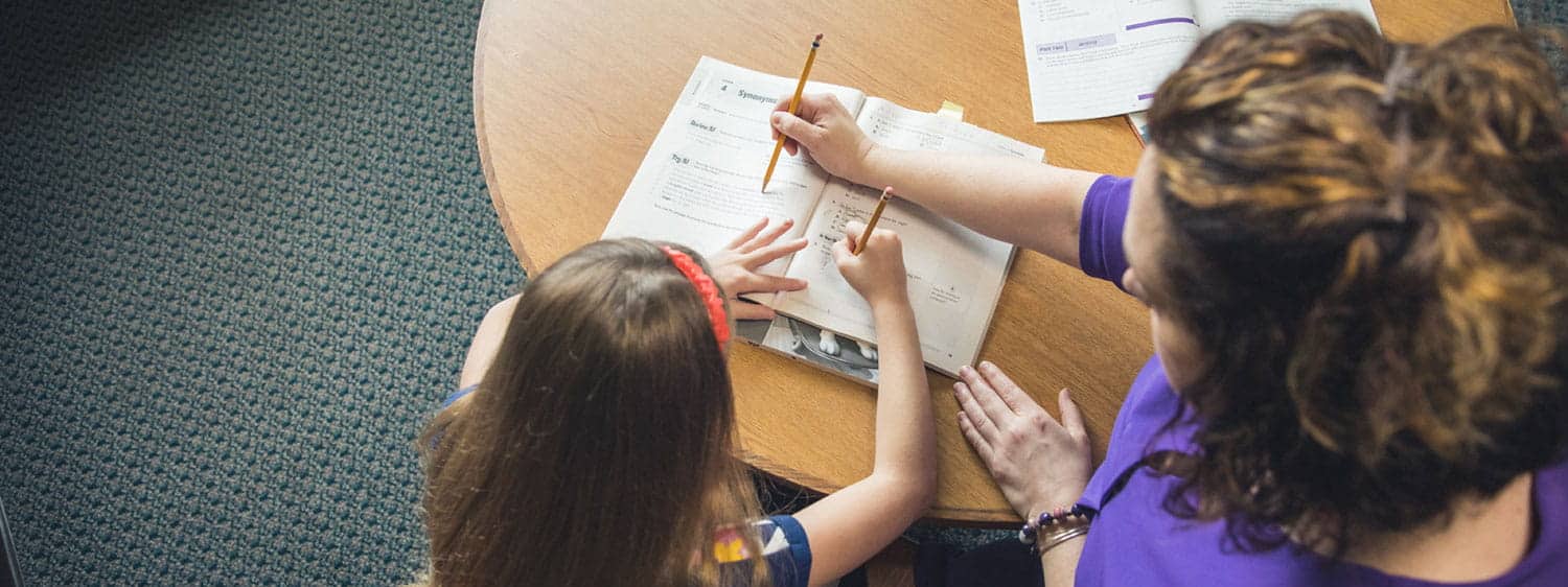 A student being taught by an alumnus of Regent, a Christian university that offers an elementary education degree.