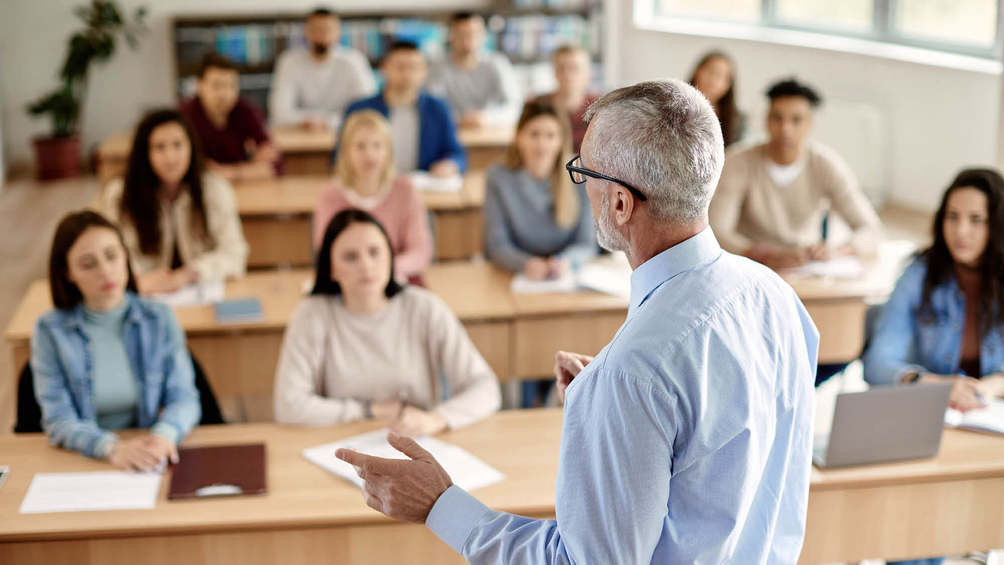 A group of graduate students in a classroom of Regent University's School of Education for prospective teachers.