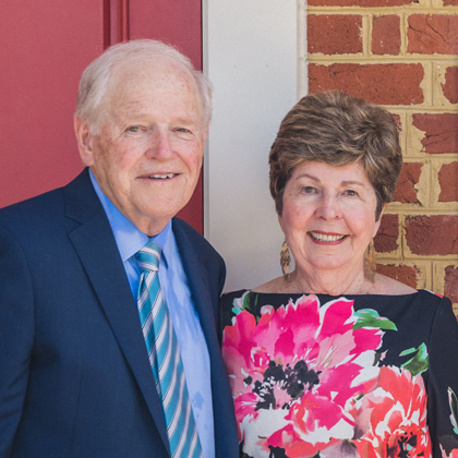 Jack E. Shaw and His Wife Jane standing in front of the Shaw Chapel at Regent University.